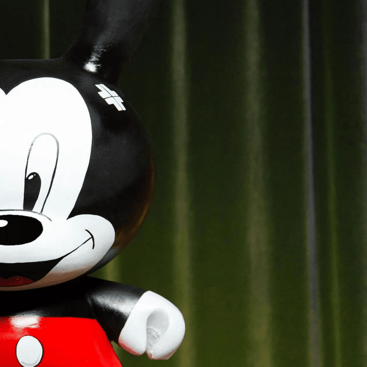 Kidrobot – Mickey Mickey Mouse, Walt Disney tarafından yaratılmış bir çizgi film karakteridir. İlk olarak 1928'de "Steamboat Willie" adlı çizgi filminde görülmüştür ve o zamandan beri birçok Disney yapımında yer almıştır. Mickey, büyük siyah kulakları, be